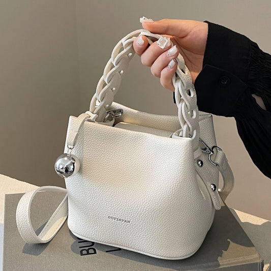 Elevate your style with the high-quality hand-held bucket bag, featuring a chic design and durable materials.